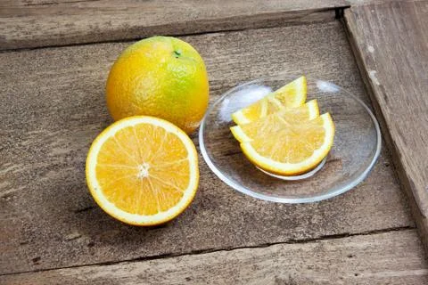 Orange sliced in half and thinly sliced Stock Photos