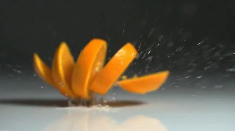 Orange sliced in slow motion Stock Footage 24738146