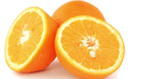 Orange Slices 360 degree turning on the white background. Full HD loop video Stock Footage 74478010