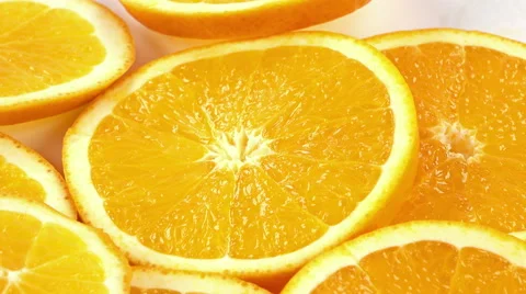 Orange slices as background texture close-up rotation. Видео 63532984