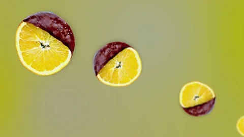 An orange slices in chocolate diagonal move and spinning Stock Footage 163438050