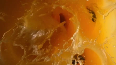 Orange slices fall into their own juice Stock Footage 165140439