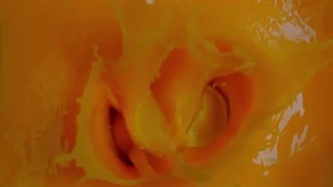 Orange slices fall into their own juice Stock Footage 168548647
