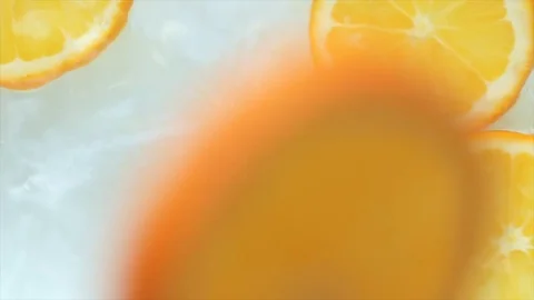 Orange slices falling into the water. Slow motion Stock Footage 71501481