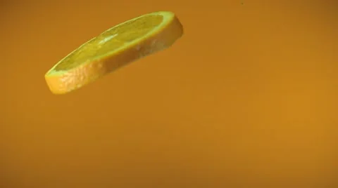 Orange slices fly and spin Stock Footage 48485774