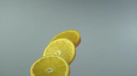 Orange slices fly and spin Stock Footage 48488373