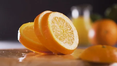Orange slices splashing into the table. Stock Footage 102259250