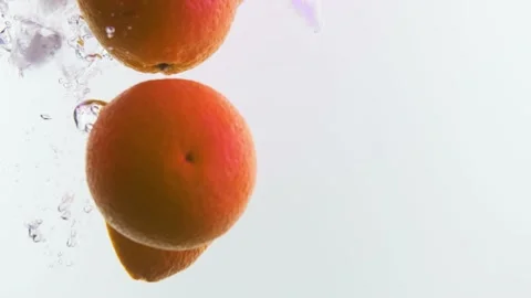 Orange slices in water. Falling oranges. Stock Footage 142315155