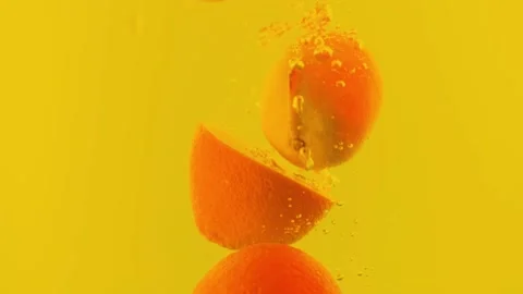 Orange slices in water. Falling oranges. Stock Footage 142315216