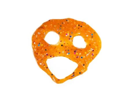 Orange slime with sequins in shape of face, ghost, grimace on white background Stock Photos
