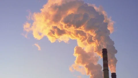 Orange smoke from the chimneys at sunset 库存影片 72452872