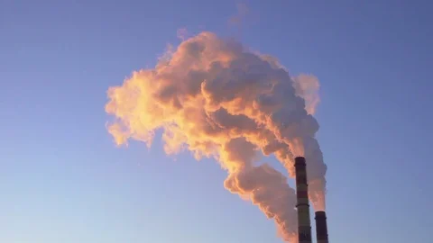 Orange smoke from the chimneys at sunset Stock Footage 72453460