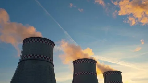 Orange smoke from the chimneys of a thermal power plant at sunset Stock Footage 72936664