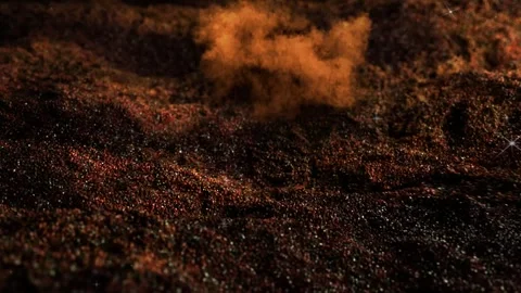 Orange smoke clouds rising above dark textured terrain under distant sparkling Stock Footage 346123675