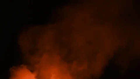 Orange smoke coming from a large fire Stock Footage 75423917