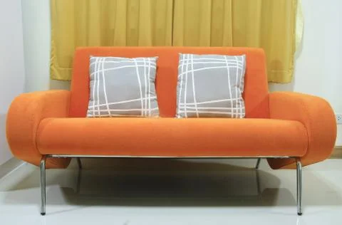 Orange sofa Stock Photos