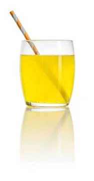 An orange soft drink with a straw 库存照片