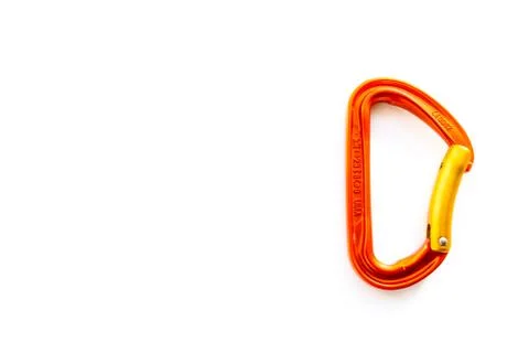 Orange solid bent gate carabiner for rope clipping, isolated on white background 스톡 사진