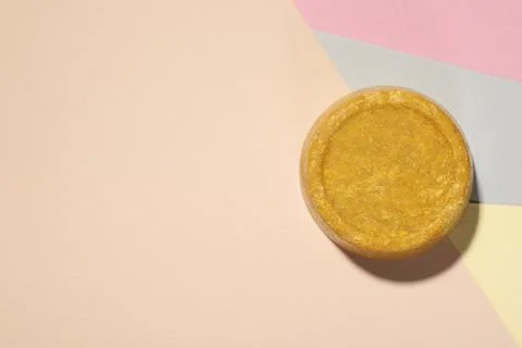Orange solid shampoo bar on color background, top view. Space for text Stock Photos