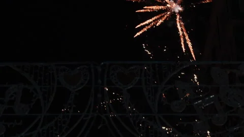 Orange spark bursting through Fallas decorative metalwork at night in Valencia Video stock 336275228
