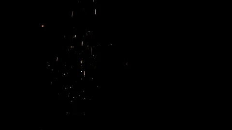 Orange sparks fall vertically in slow motion Stock Footage 326756574