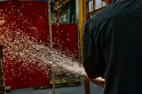 Orange Sparks Flying Over During Metal Grinding Stock Photos
