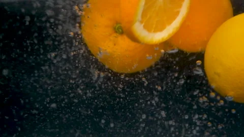 Orange splashing on water Stock Footage 241030664