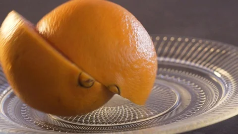 Orange splits into two parts Stock Footage 124314225