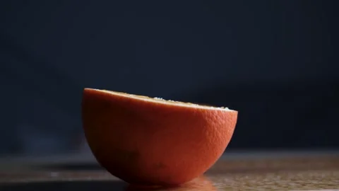 Orange Splitting in Half by Itself Creative Concept Close Up Stock Footage 329103210