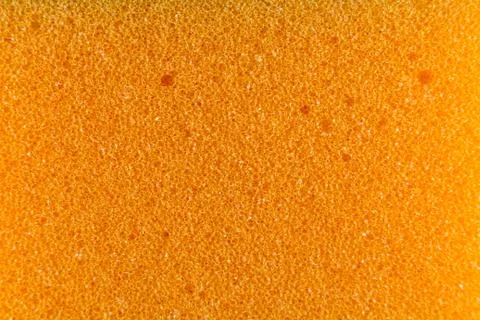 Orange sponge made of microfiber material. Texture, background. In Increase Stock Photos