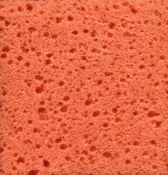 Orange sponge surface Stock Photos