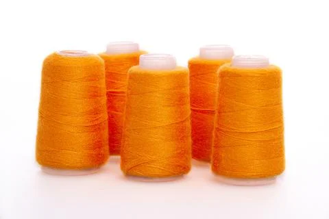 Orange spool of thread isolated on white background. Skein of woolen threads Stock Photos
