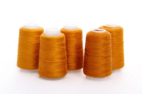 Orange spool of thread isolated on white background. Skein of woolen threads Stock Photos