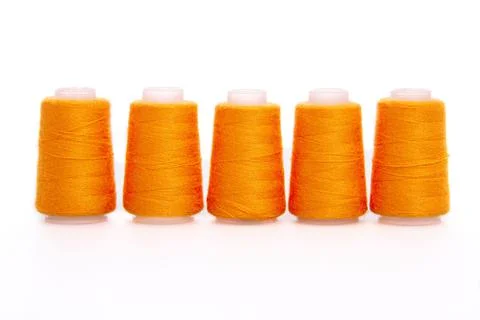Orange spool of thread isolated on white background. Skein of woolen threads Stock Photos