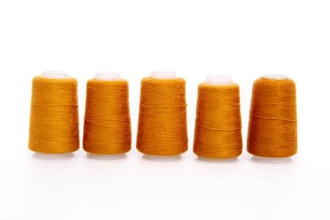 Orange spool of thread isolated on white background. Skein of woolen threads Stock Photos