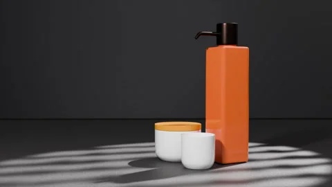 Orange square liquid soap bottle on dark background, dramatic light Stock Footage 313555607