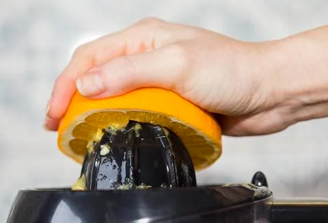 Orange squeezing Stock Photos