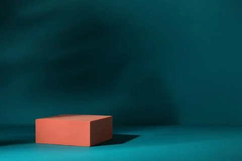 Orange stand on teal background, space for text. Stylish presentation for p.. 스톡 사진