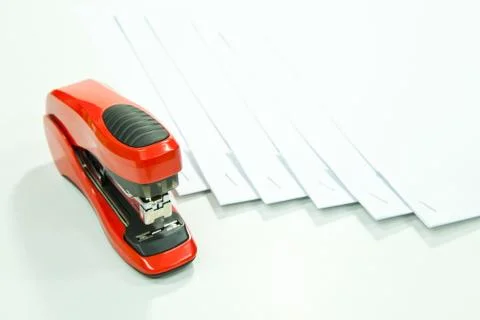 Orange stapler Stock Photos