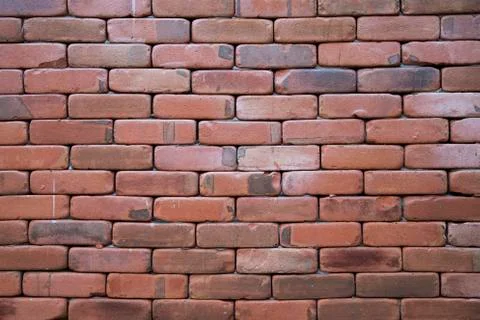 Orange stone brick wall Stock Photos