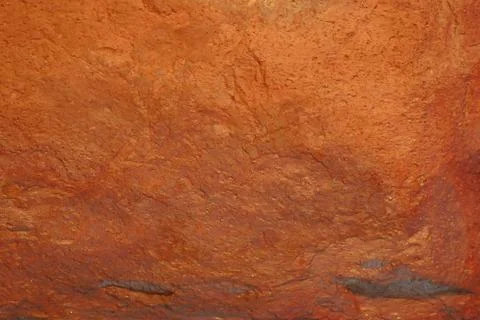 Orange stone wall. Abstract pattern. Stone texture. Stock Photos