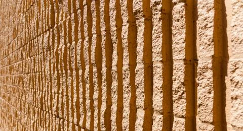 Orange stone wall background Stock Photos