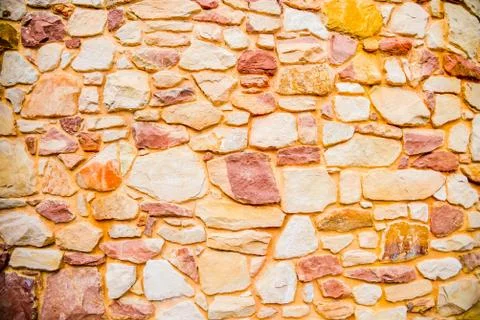 Orange stone wall pattern Stock Photos