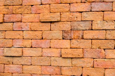 Orange stone wall Stock Photos