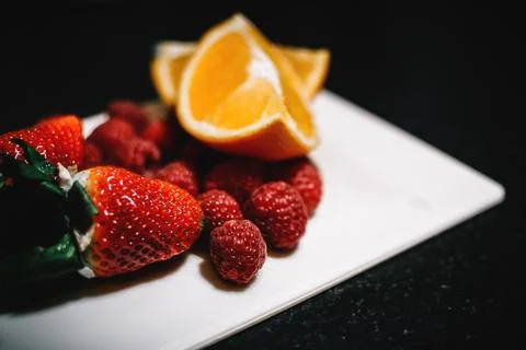 Orange, strawberry, raspberry, plate, fruit, food, dark, background, fresh,.. Stock Photos