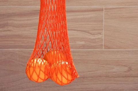 Orange string bag Stock Photos