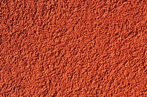 Orange stucco wall pattern for background. Concrete wall shows texture of cement Stock Photos