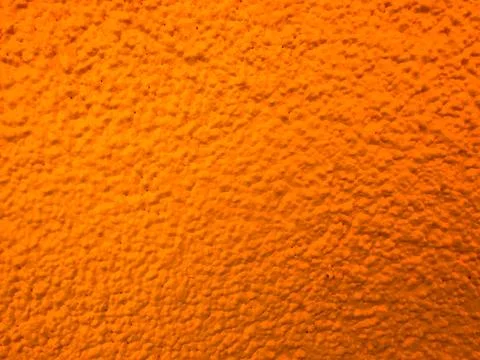 Orange Stucco Wall Texture With Rough Painted Surface Stock Photos