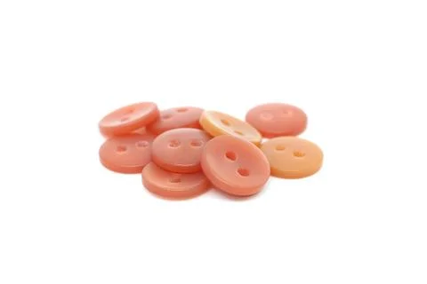 Orange Studs on isolated white background Stock Photos