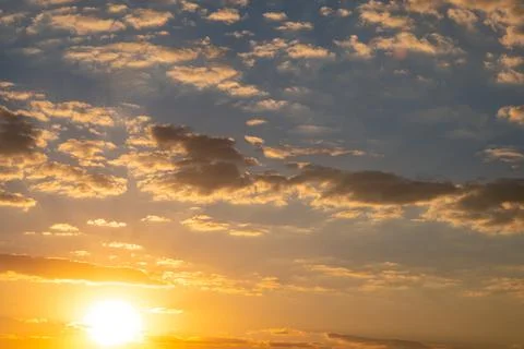 Orange sun and cloudy evening sky, evening sunset sky background Stock Photos